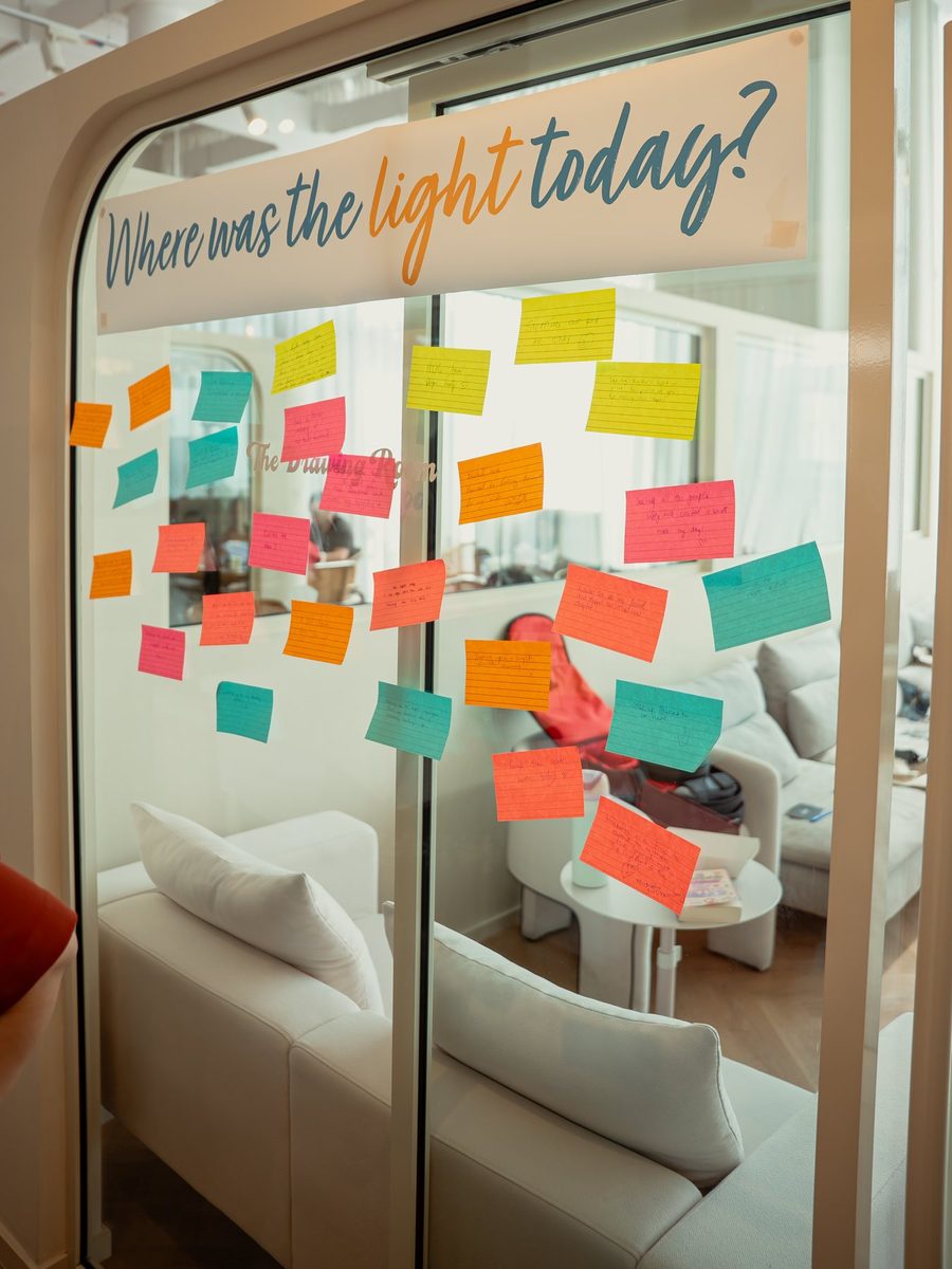 A glass wall at the launch covered in handwritten notes under a banner reading Where was the light today?